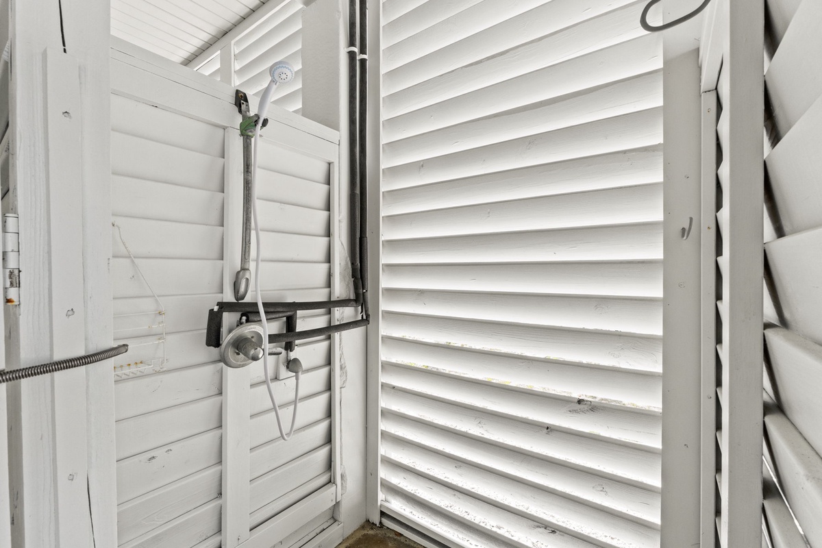 Refresh in your private outdoor shower with tropical-style louvered walls for natural ventilation and complete privacy.