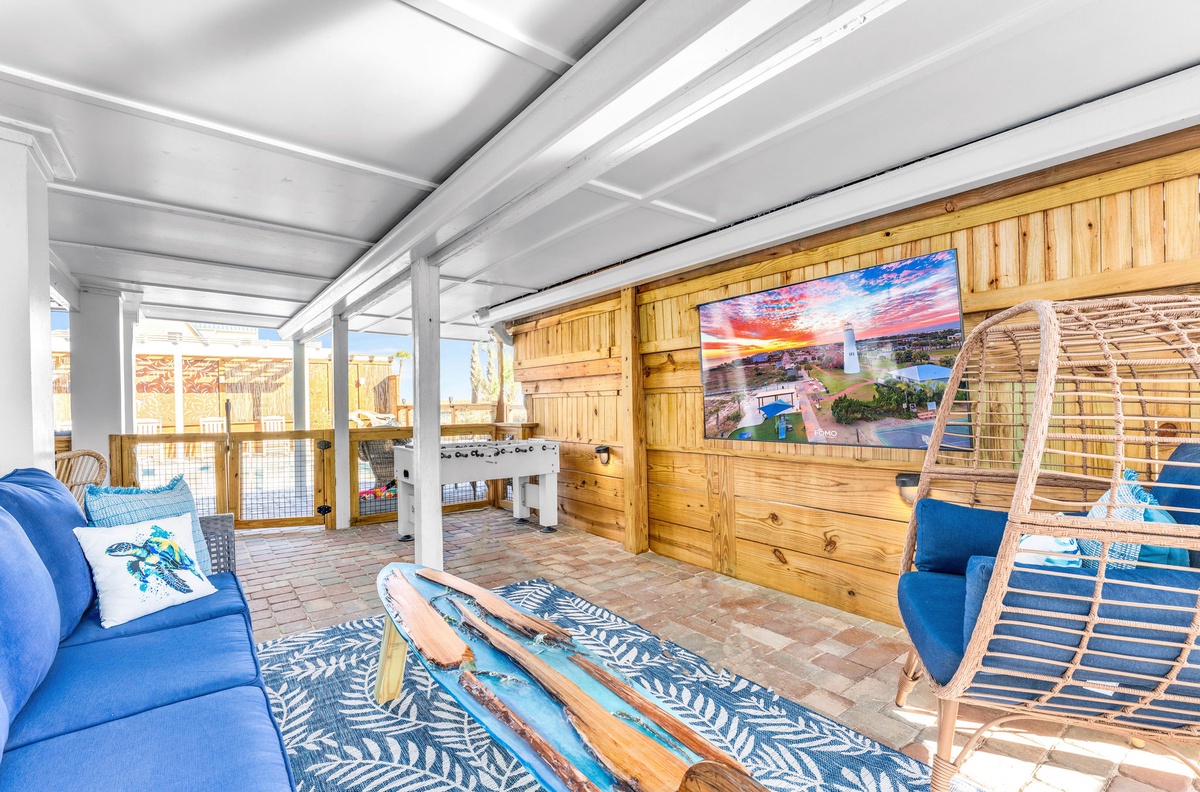 Relax in the outdoor tv area while watching your favorite sports team and movies by the pool.