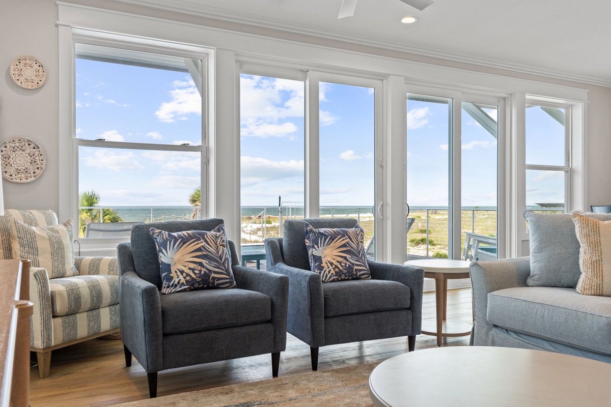 Settle into the cozy armchairs and watch the waves roll in—the ocean is right at your doorstep, framed perfectly by floor-to-ceiling windows.
