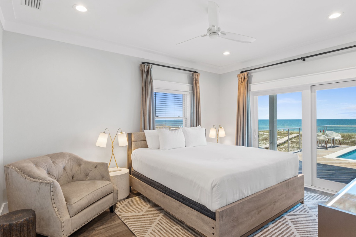 Wake up to stunning ocean views through expansive windows, then step out to your private pool and beachfront access. This serene retreat offers plush bedding, cozy seating, and coastal breezes—your perfect seaside escape awaits.