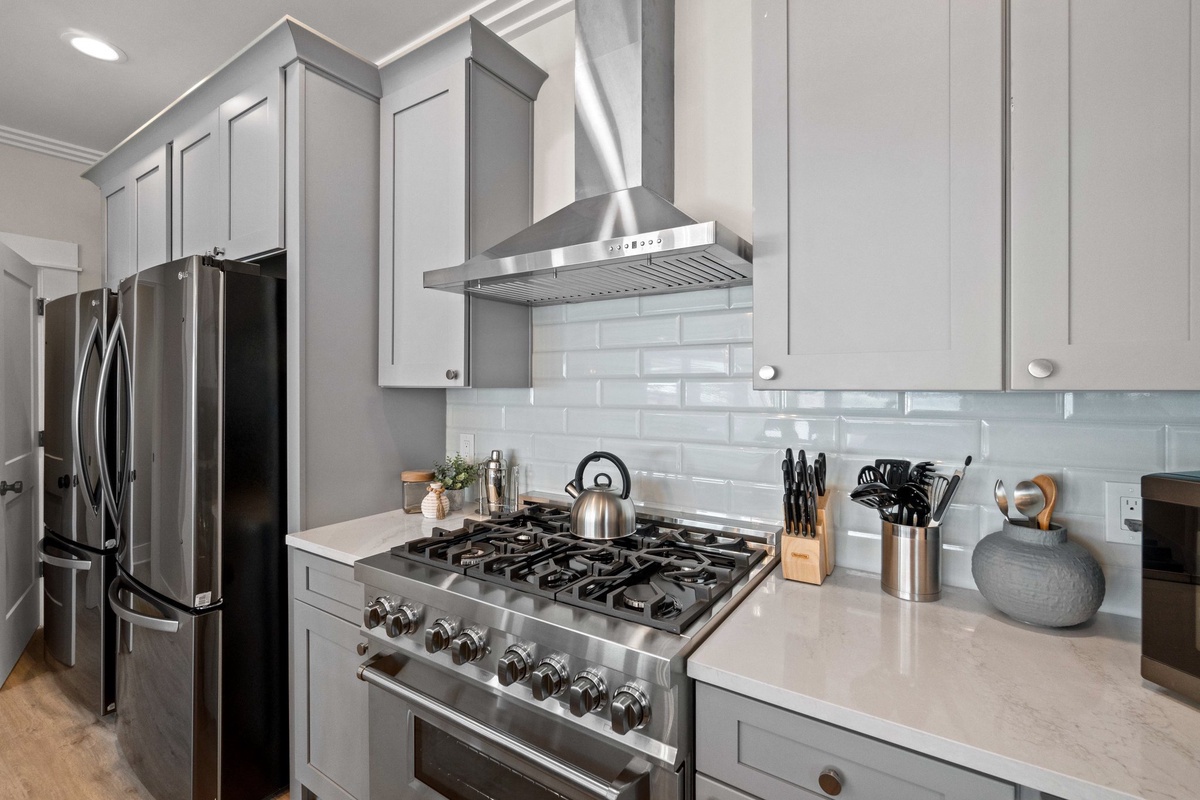 Your modern kitchen awaits with stainless steel appliances and sleek countertops, perfect for preparing memorable meals during your stay.