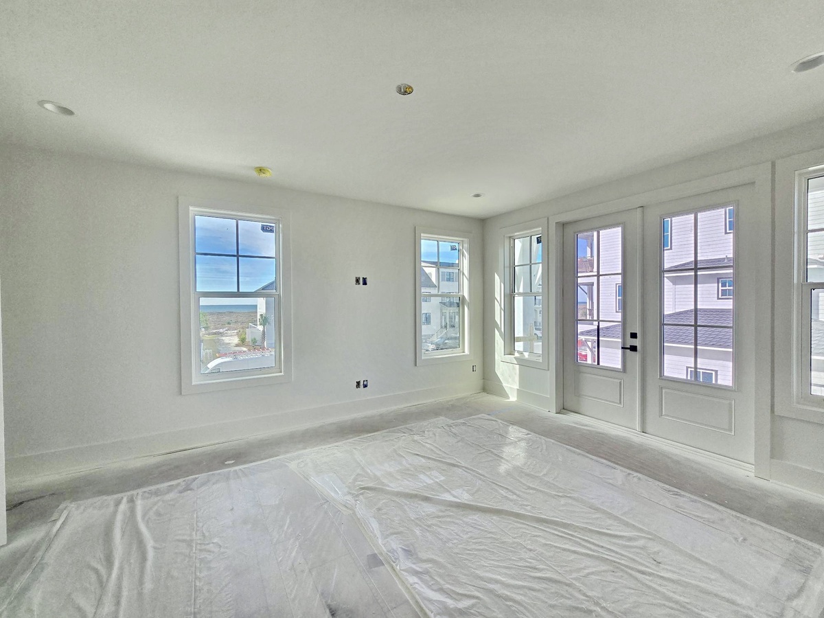 Bright, airy room with multiple windows and French doors opening to your private balcony with lovely neighborhood views.