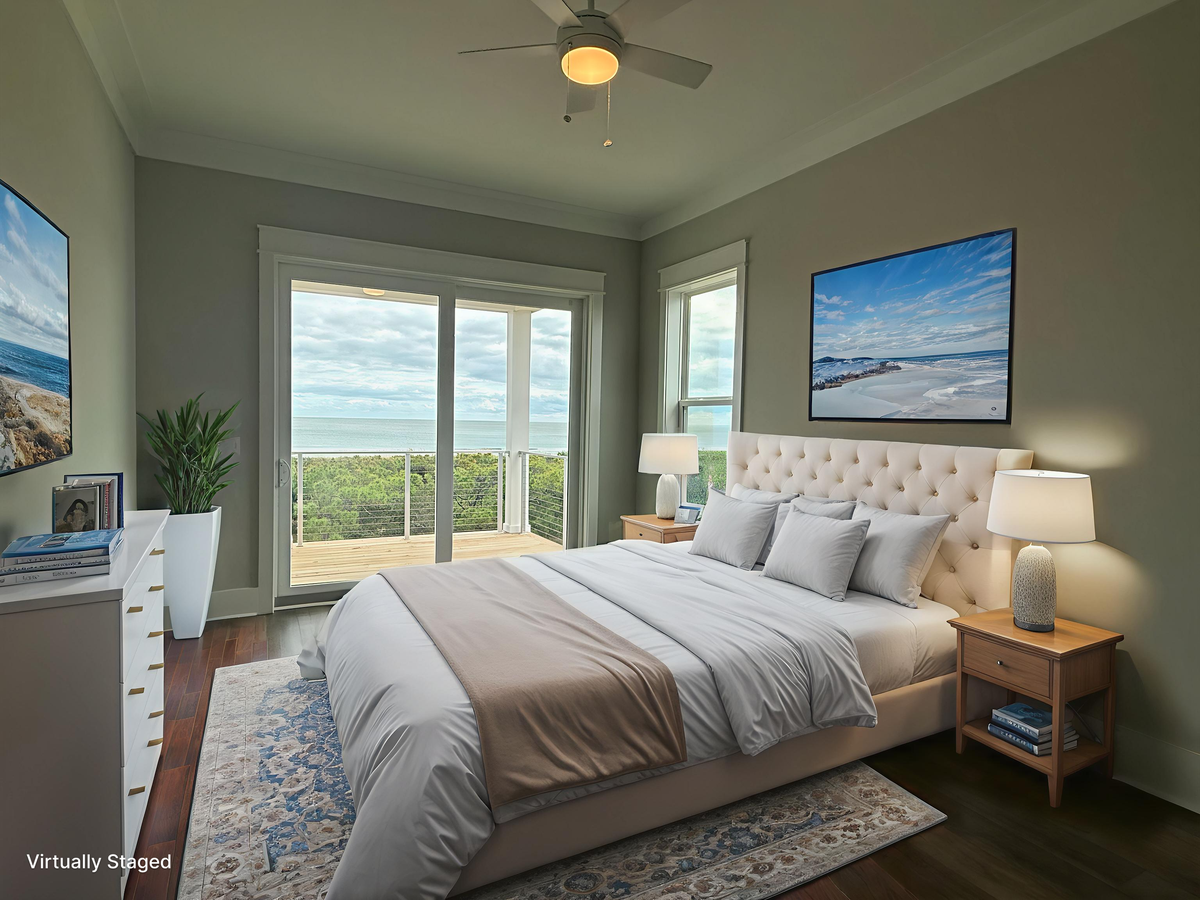 Wake up to stunning ocean views from your plush bed, where crisp linens and coastal artwork create your perfect seaside retreat.