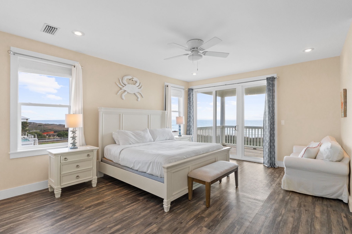 Wake up in your coastal-themed bedroom with ocean views through private balcony doors and windows.