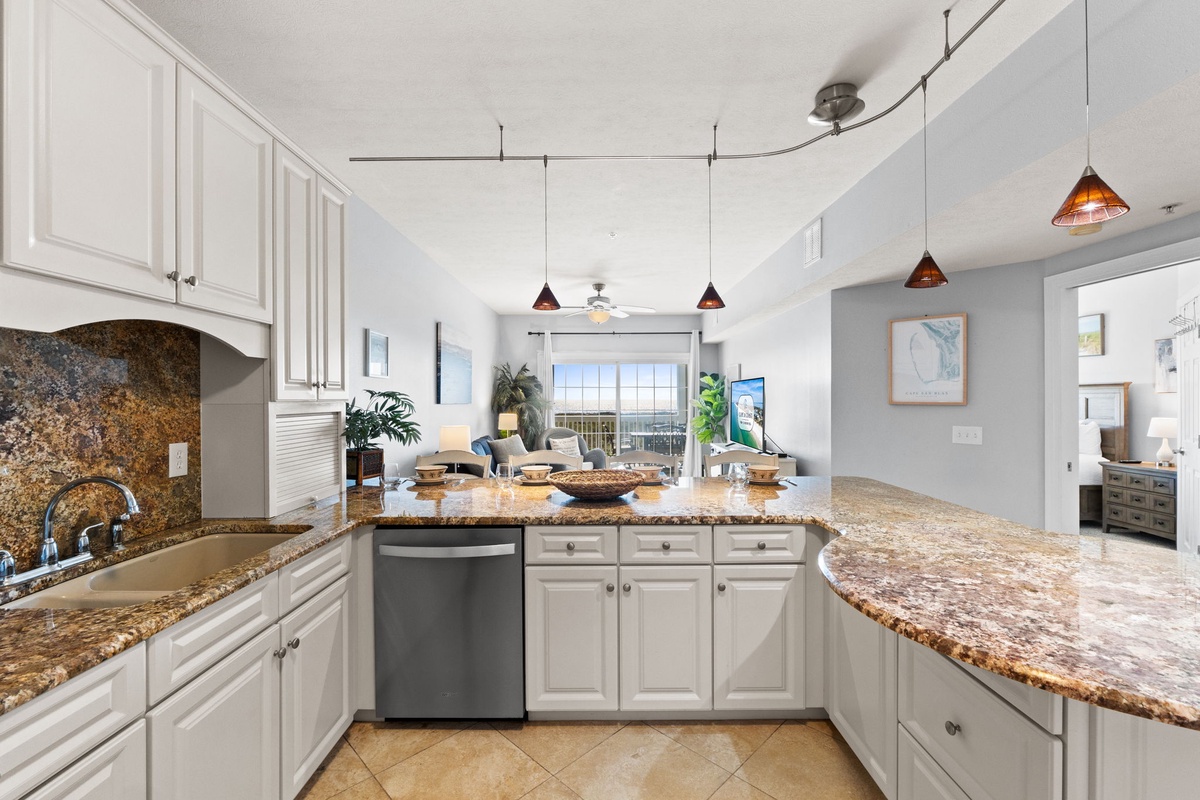 Your spacious kitchen features granite countertops, modern appliances, and stylish pendant lighting for memorable meal preparation.