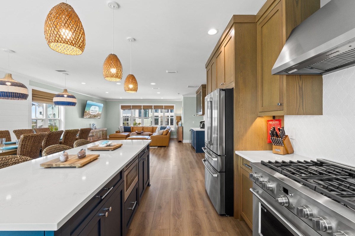 Cook up your favorite meals in this bright, open kitchen featuring modern appliances, plenty of counter space, and a welcoming flow into the living area where you can unwind.