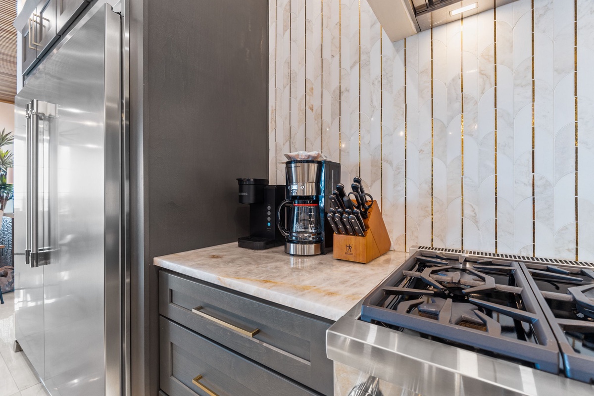 Your gourmet kitchen awaits with stainless steel appliances, gas range, quality cookware, and thoughtful touches that make every meal feel special.
