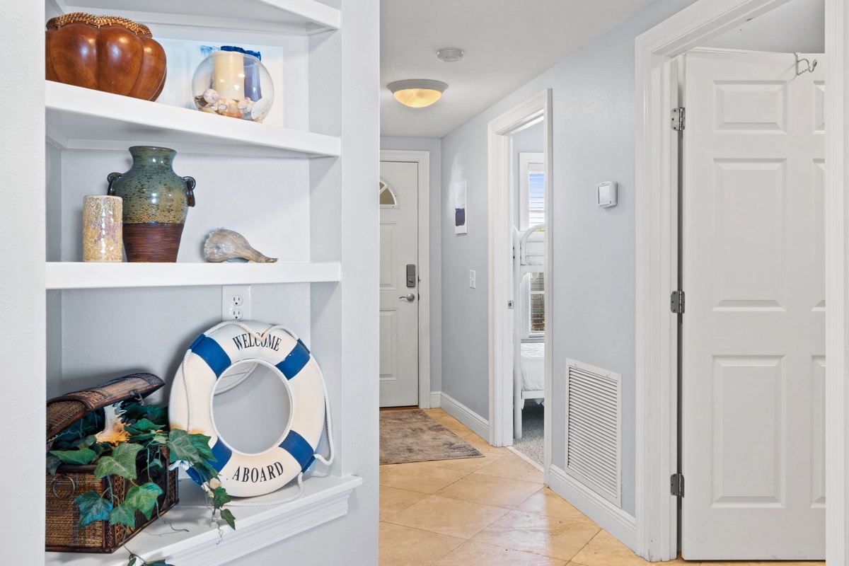 Your charming entryway welcomes you with coastal décor and nautical touches that set the perfect vacation mood.