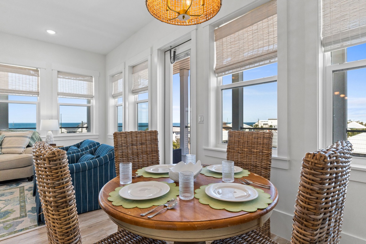 Gather around your sun-drenched dining table where ocean views frame every meal in this coastal haven.
