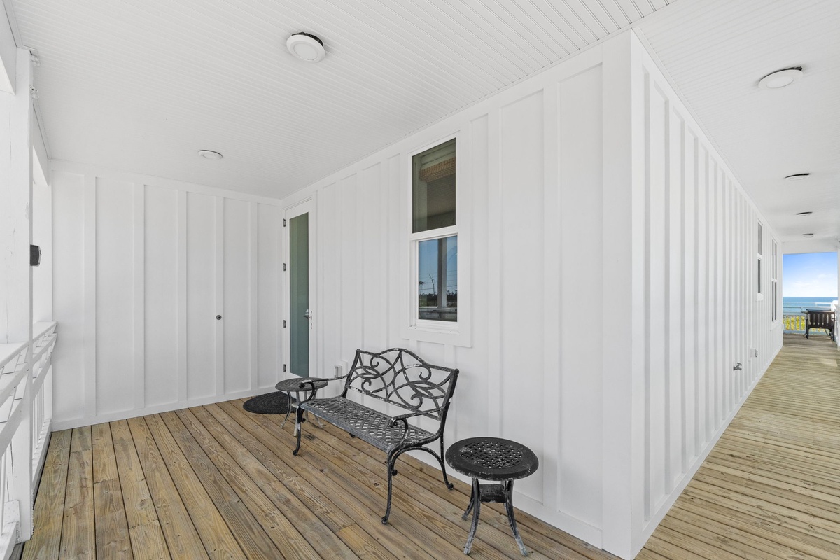 Your private covered balcony features charming cast iron seating where you can relax with morning coffee or evening conversations.