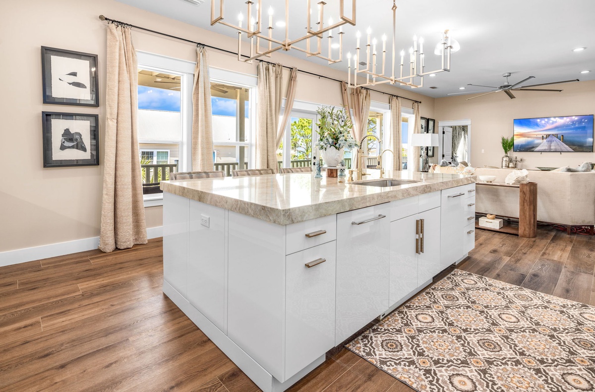 Your gourmet kitchen awaits with gleaming countertops, modern appliances, and elegant lighting perfect for creating memorable meals together.