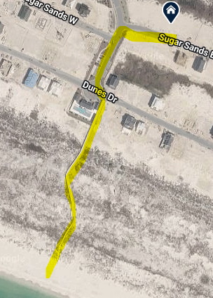 Aerial view showing the property's beach access via community boardwalk.