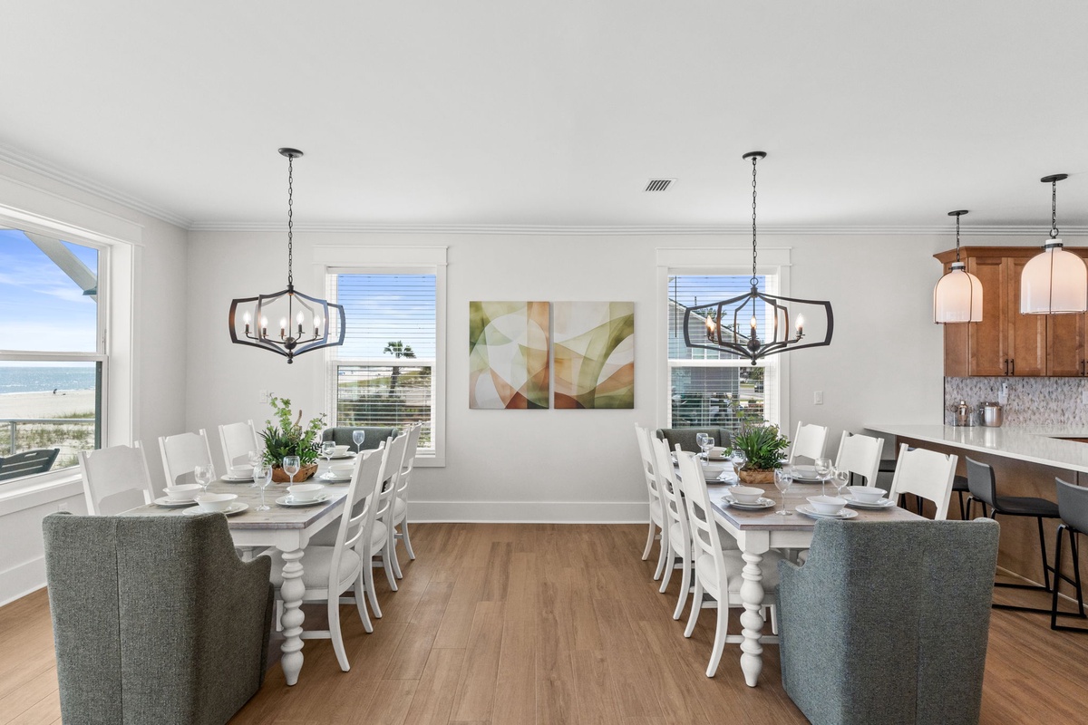 Gather around the spacious dining tables where sunlight streams through coastal windows, perfect for morning coffee or evening feasts with your favorite people.