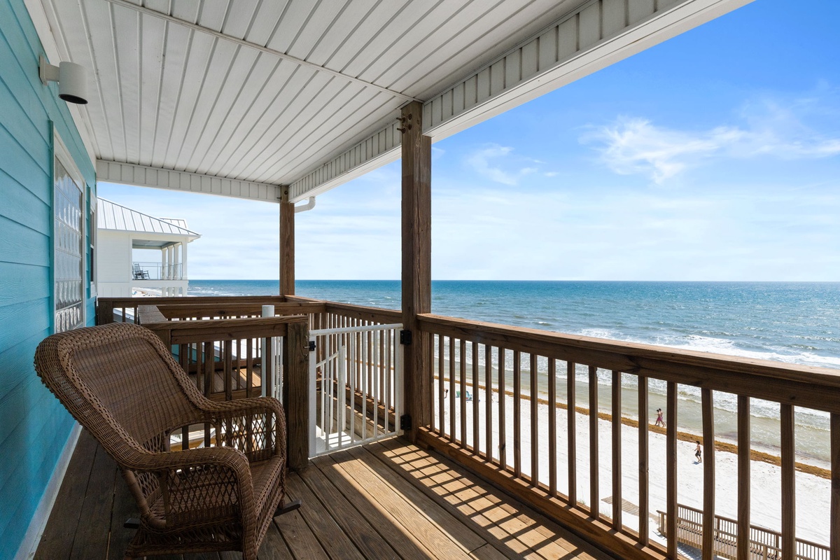 Your private beachfront balcony features cozy seating perfect for morning coffee or watching waves roll in. Breathe in salty air as you gaze at endless ocean views.