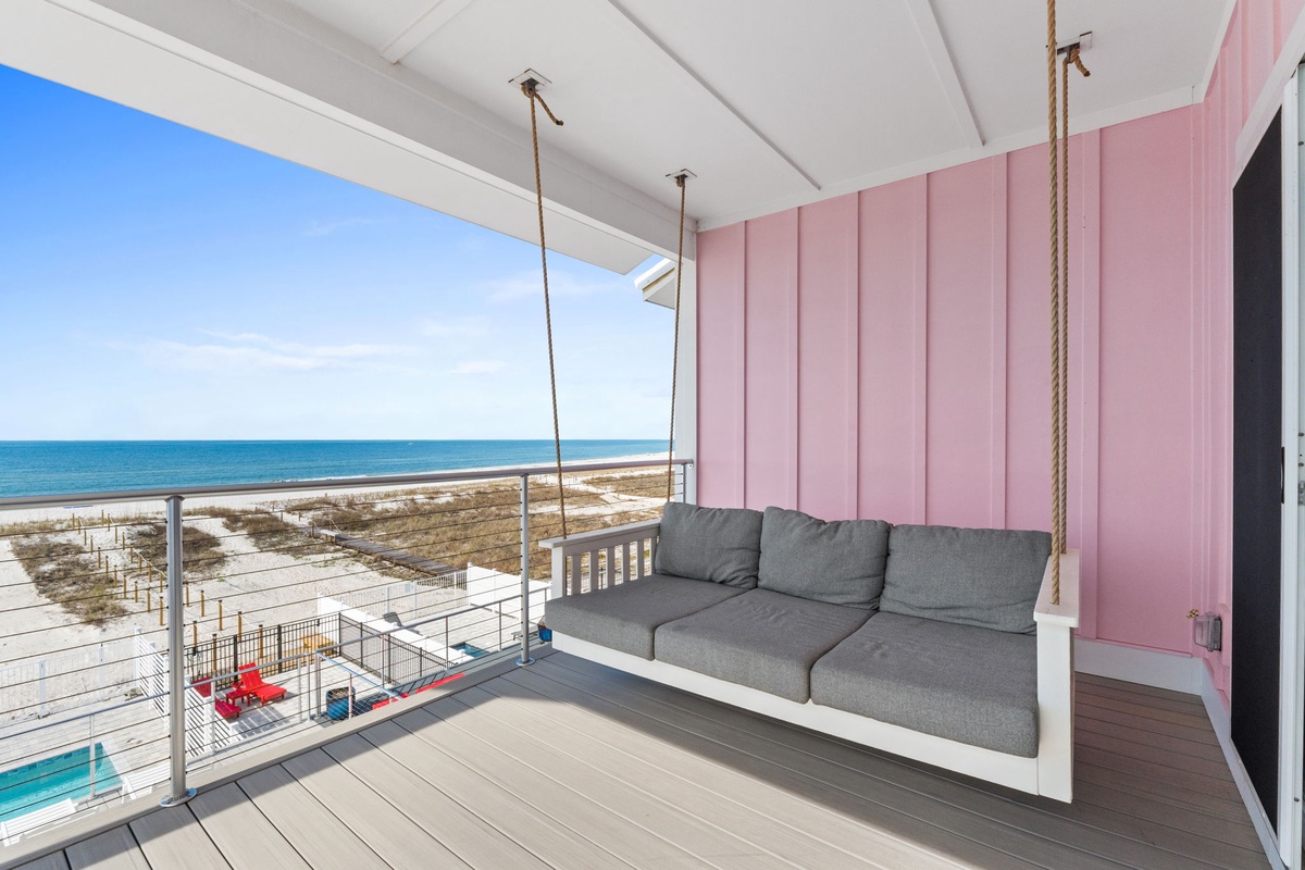 Swing away your worries on this charming porch daybed, where ocean views and gentle breezes create your perfect seaside retreat.