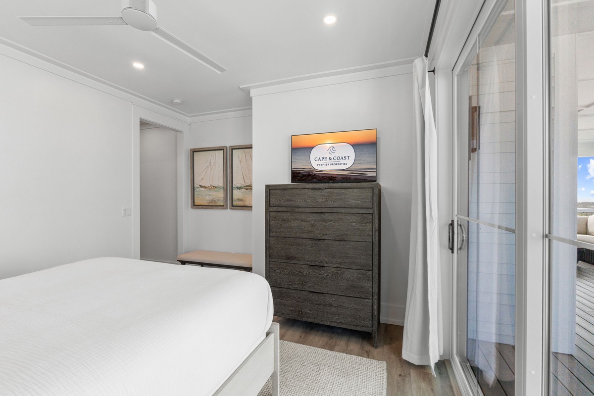 Drift off to sleep in your serene bedroom, where coastal artwork and modern furnishings create the perfect retreat after your adventures.