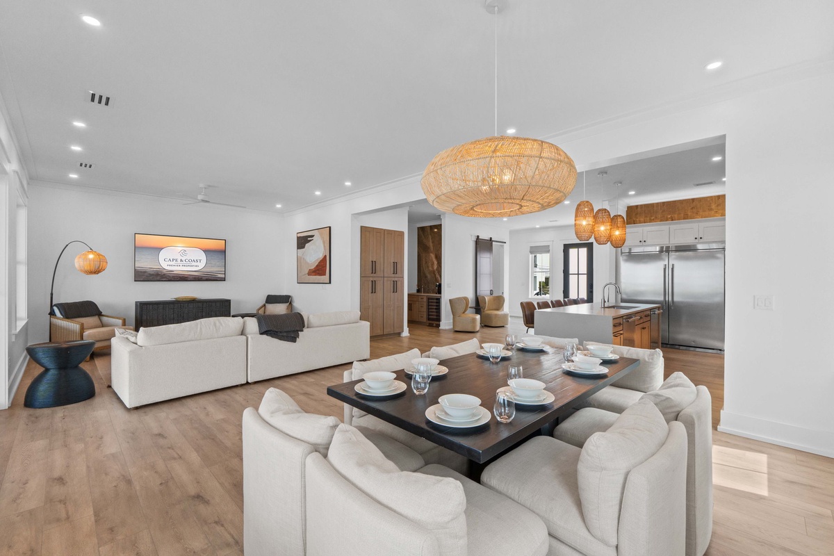 Settle into this spacious, light-filled retreat where relaxed coastal style meets refined comfort—perfect for gathering around the dining table or unwinding in the plush living area.