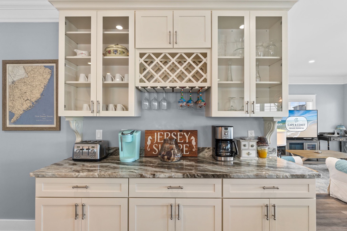 Step into your gourmet kitchen where marble countertops and custom cabinetry create the perfect space for preparing meals and entertaining guests.