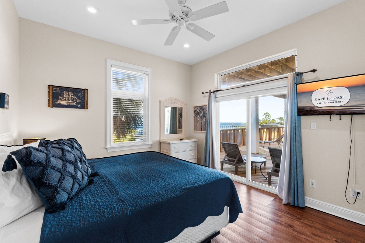 Wake to ocean breezes in your coastal bedroom with private balcony access and peaceful water views.
