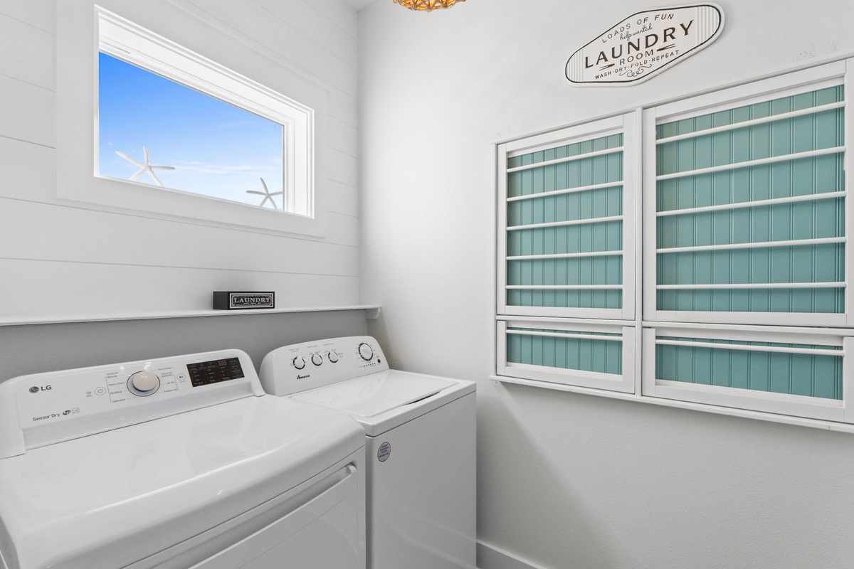 Your dedicated laundry room features full-size appliances and charming coastal details to make wash day feel effortless.