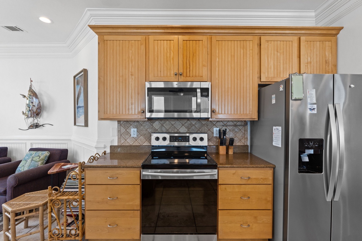 Your fully-equipped kitchen invites you to cook with ease, featuring stainless steel appliances, warm wood cabinetry, and all the tools you'll need for perfect vacation meals.