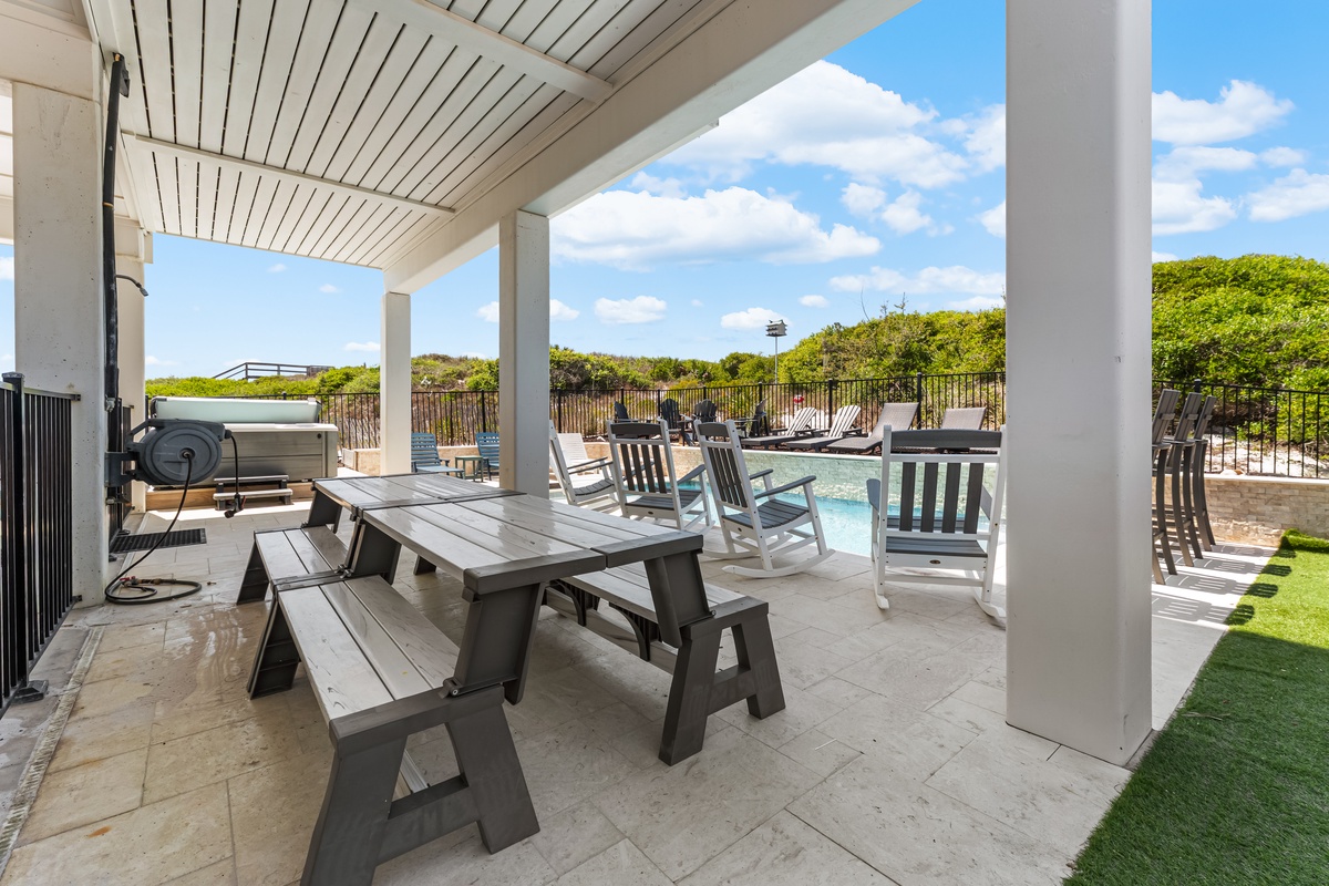 Your covered outdoor dining area features BBQ facilities and pool views, perfect for memorable family meals.
