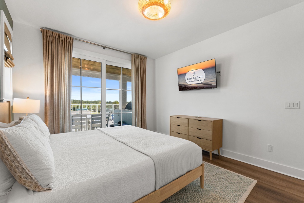 Slip into crisp linens and wake to sunlight streaming through your private balcony doors. Modern comfort meets coastal serenity in this peaceful retreat designed for restful nights.