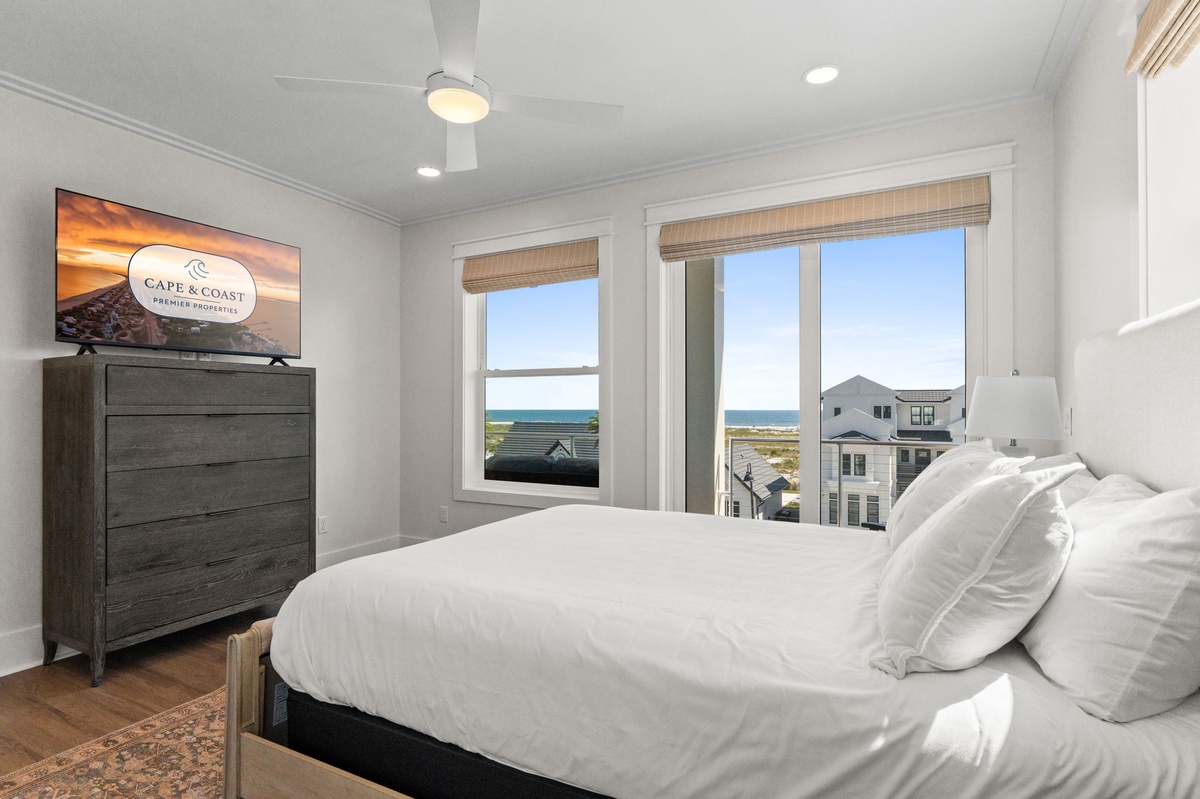 Wake up to ocean views framed by large windows in your serene, light-filled bedroom. The crisp linens and coastal breeze will make every morning feel like a dream.