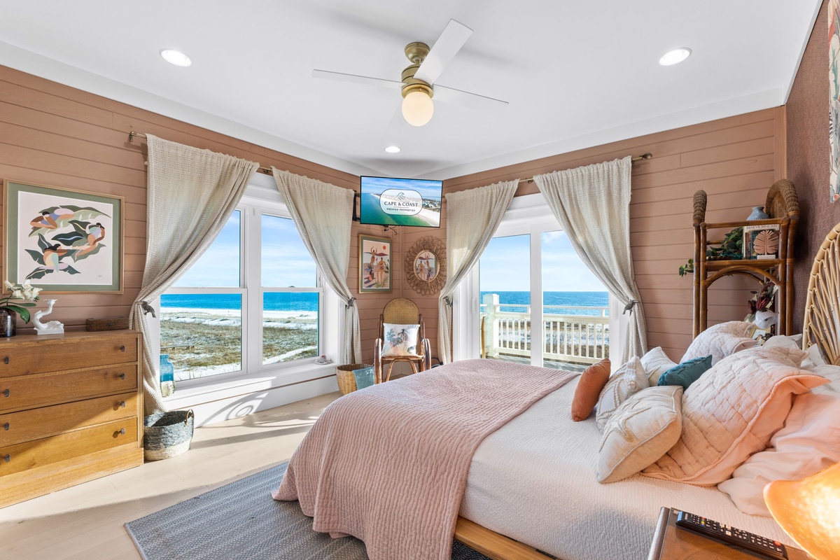 Wake to breathtaking ocean views from your coastal bedroom, where warm wood tones and soft linens create the perfect beachside retreat.