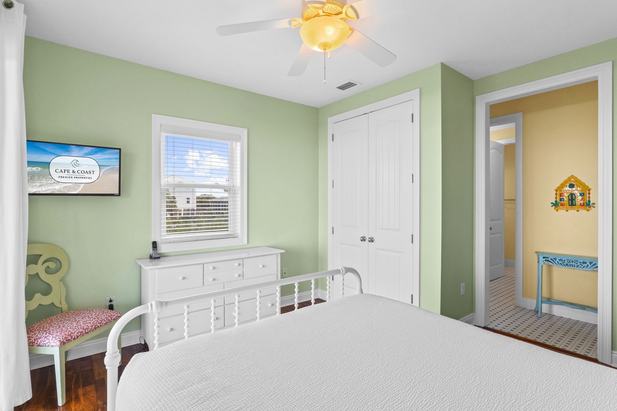 Rest easy in your coastal sanctuary with cheerful colors and thoughtful details, where natural light filters through your private window.
