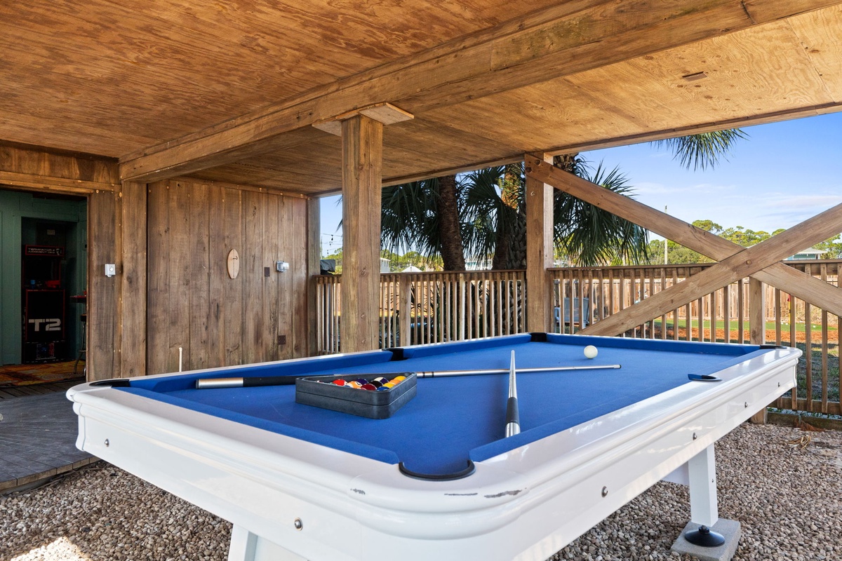 Enjoy a game of pool in a covered, open-air setting designed for laid-back afternoons.