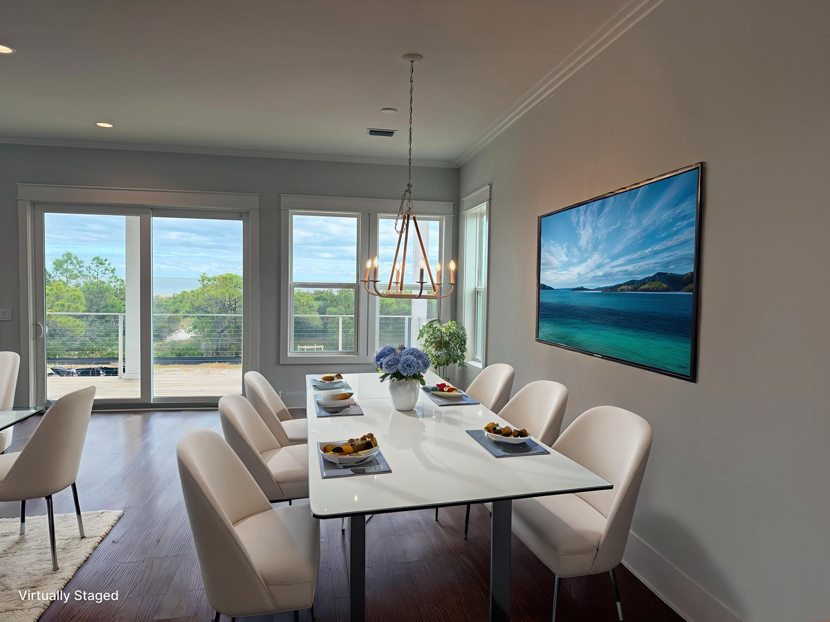 Gather around this elegant dining table for memorable meals, where stylish seating meets natural light from expansive windows.