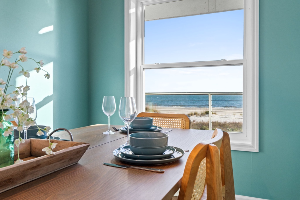 Savor your morning coffee at this charming dining nook while gazing out at endless ocean views through your picture window.