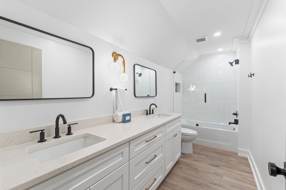 Relax in your elegant bathroom with dual vanities, soaking tub, and beautiful finishes that make your morning routine a luxurious experience.