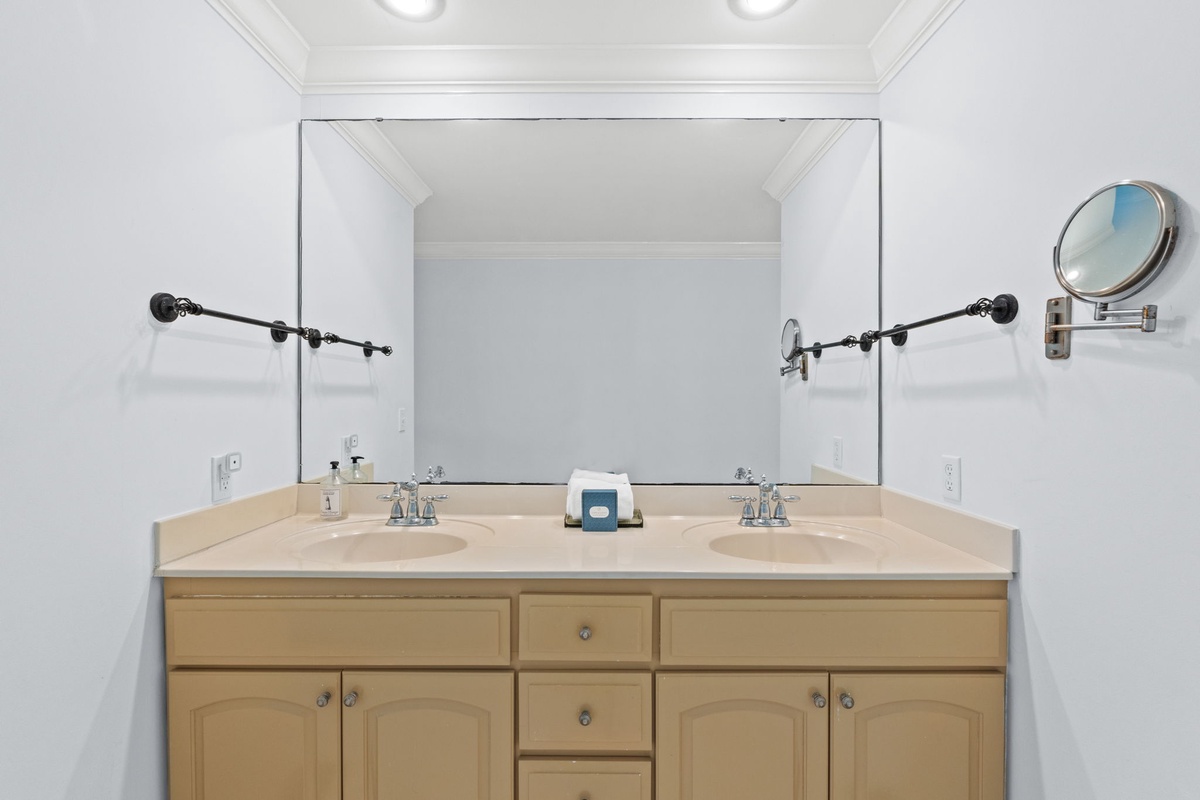 Your spacious bathroom features dual sinks and ample counter space, making morning routines effortless and comfortable.