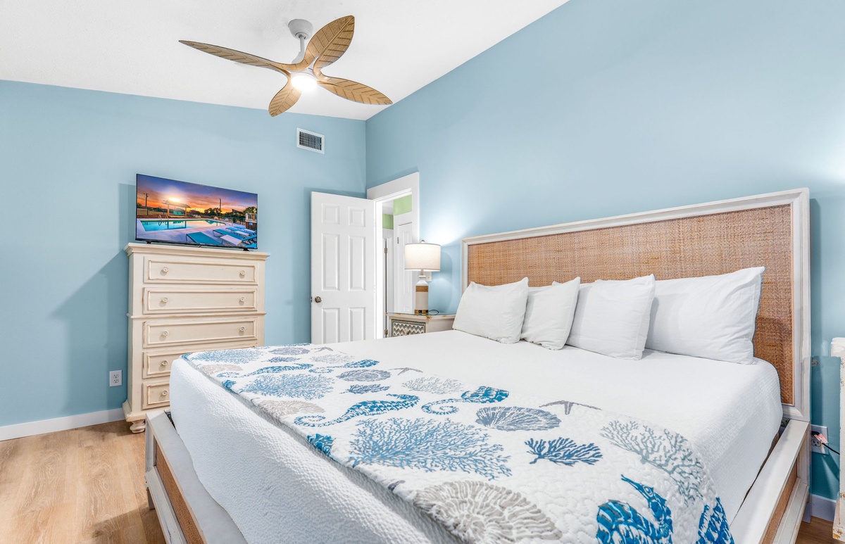 Drift off to sleep in your coastal-inspired bedroom featuring crisp linens and soothing ocean blues that create the perfect seaside retreat.