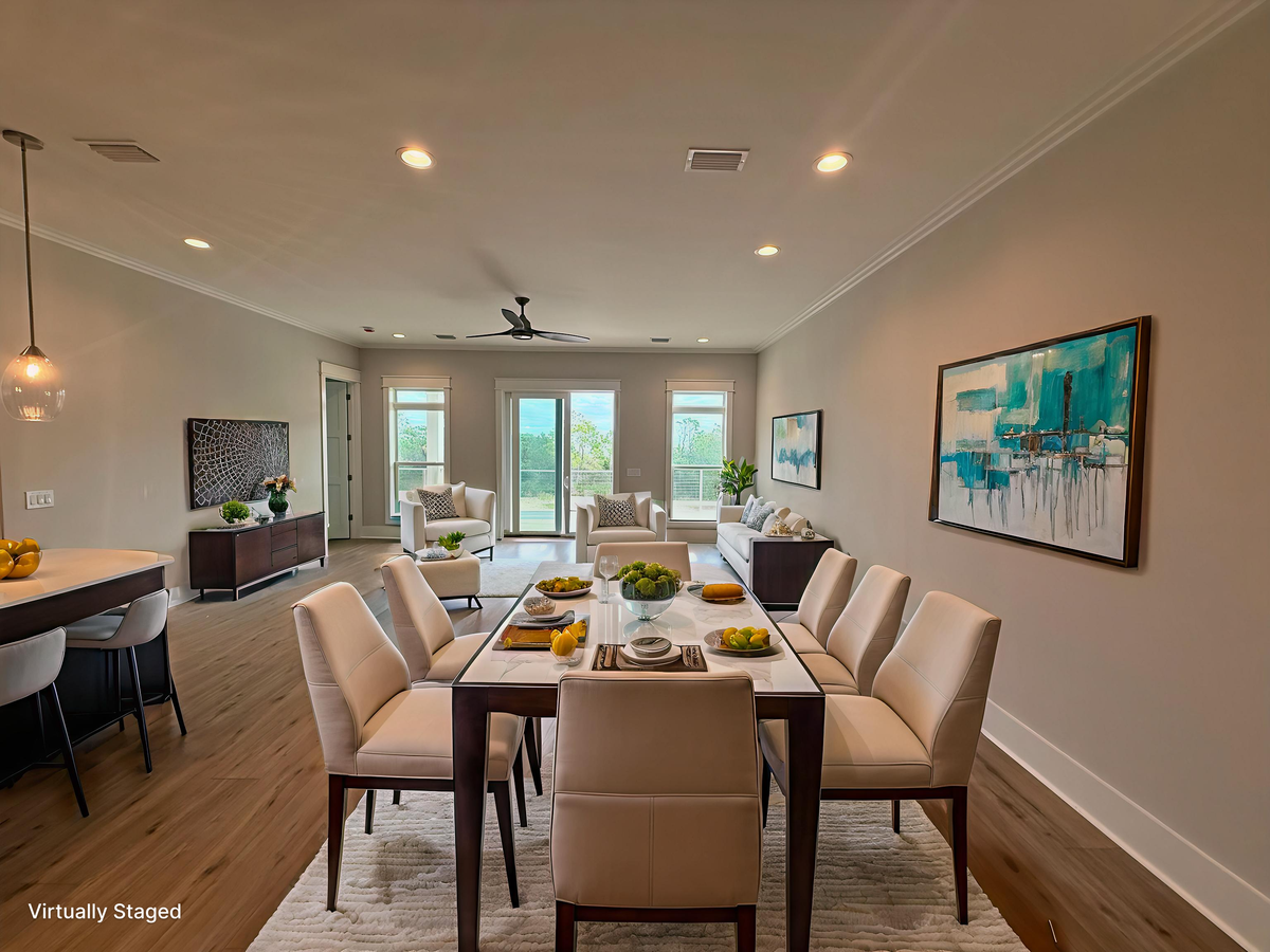 Gather around this elegant dining table where memorable meals await, while your living room beckons with comfortable seating and vibrant artwork.