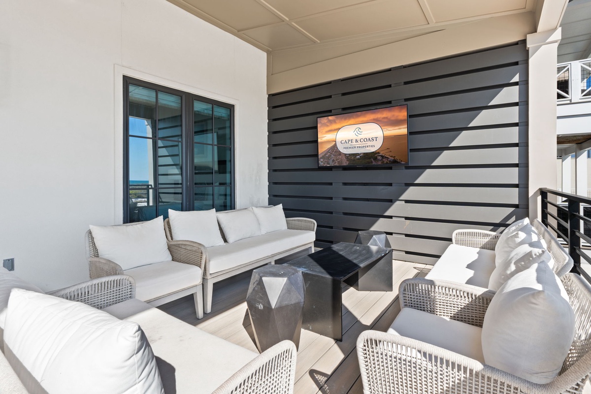 Unwind on your private terrace with plush seating and a mounted TV for perfect indoor-outdoor entertaining.