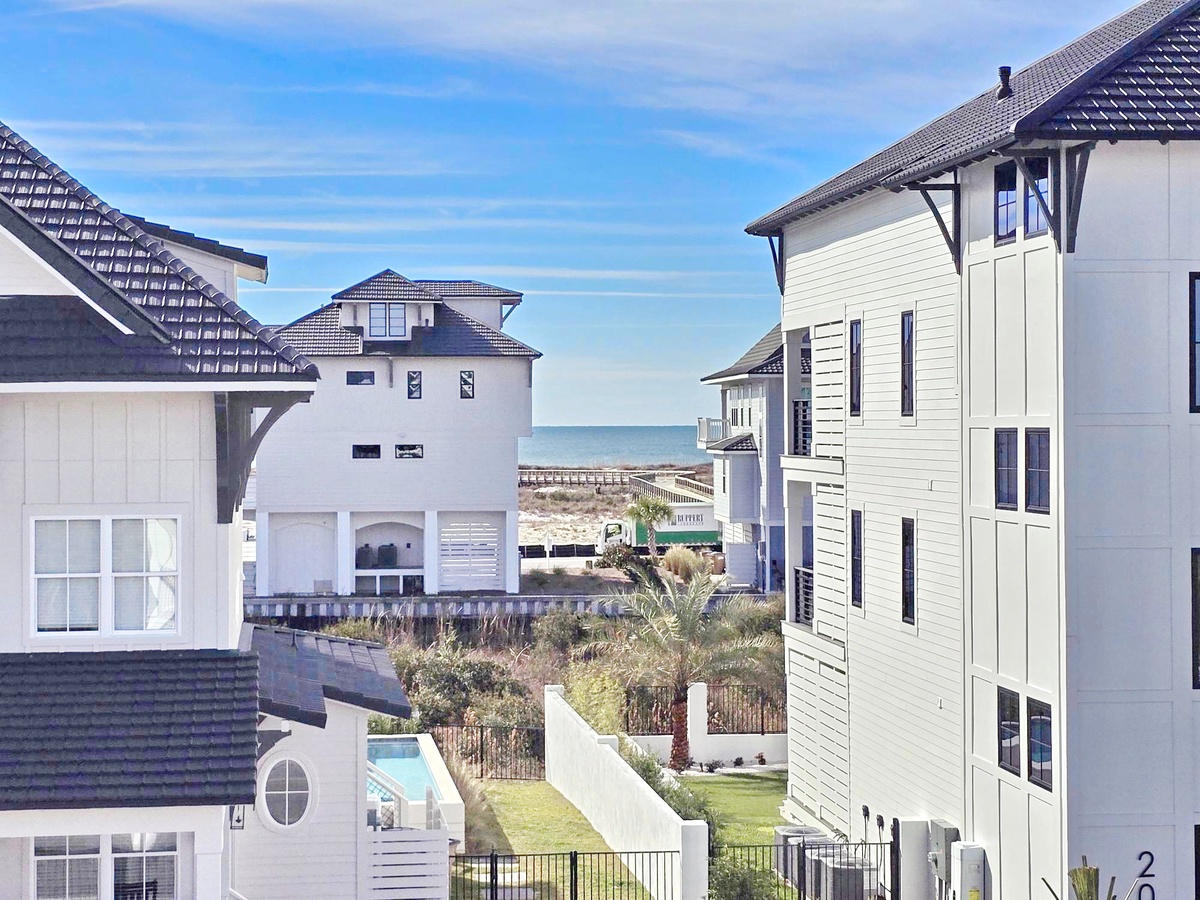 Coastal residential community with modern beach houses offering ocean access and vacation rental accommodations.