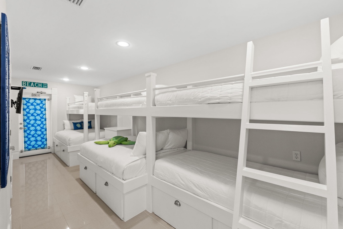 Sleep soundly in your private bunk with built-in storage and individual reading lights in this bright, modern shared room.