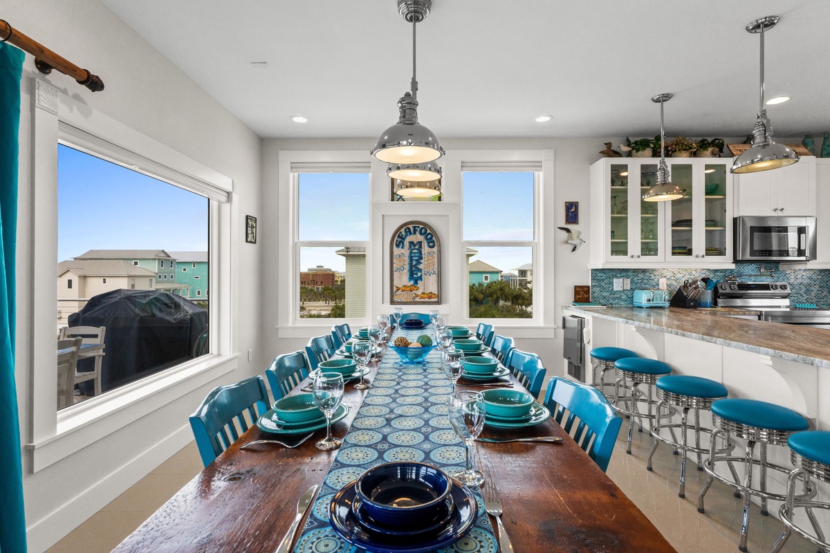 Your spacious kitchen and dining area features ocean-themed décor and seats your whole crew for memorable meals together.