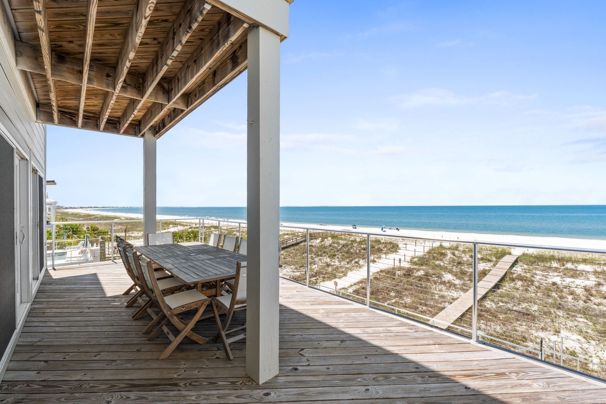 This beachfront deck offers stunning ocean views and a perfect spot to dine al fresco while enjoying sea breezes and the sound of waves.