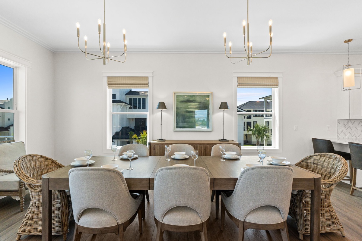 Gather around this beautiful table for meals that feel like celebrations. Natural light pours in, elegant chandeliers add warmth, and there's room for everyone to share stories and laughter.