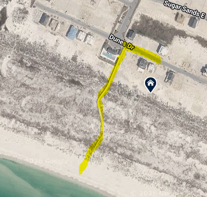 Aerial view shows your beachfront location with community boardwalk access leading to pristine white sands.
