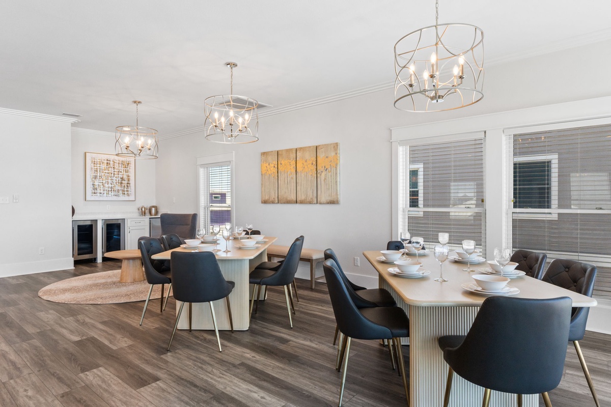 Gather around elegant tables beneath statement chandeliers in this bright dining space, perfect for memorable meals with your group. Stylish seating and sophisticated decor create an inviting atmosphere for every occasion.