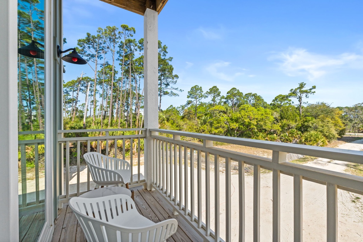 Sip your morning coffee on this private balcony while soaking in peaceful forest views and blue skies.