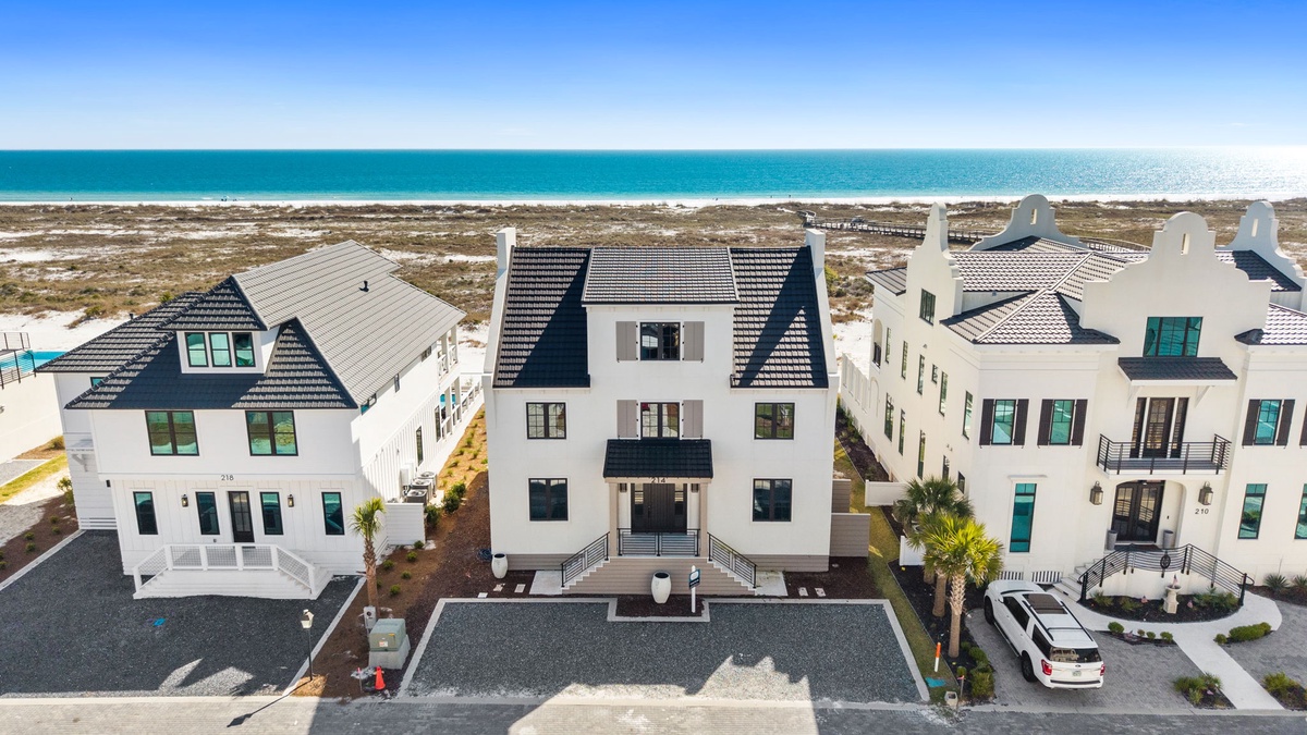 Luxury beachfront homes featuring modern coastal architecture with stunning ocean proximity and pristine white sand beaches.