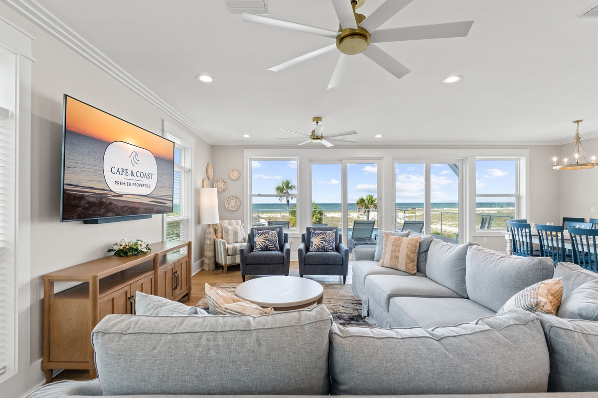Sink into plush coastal comfort while soaking in stunning ocean views through expansive windows. Your perfect beachfront retreat awaits.