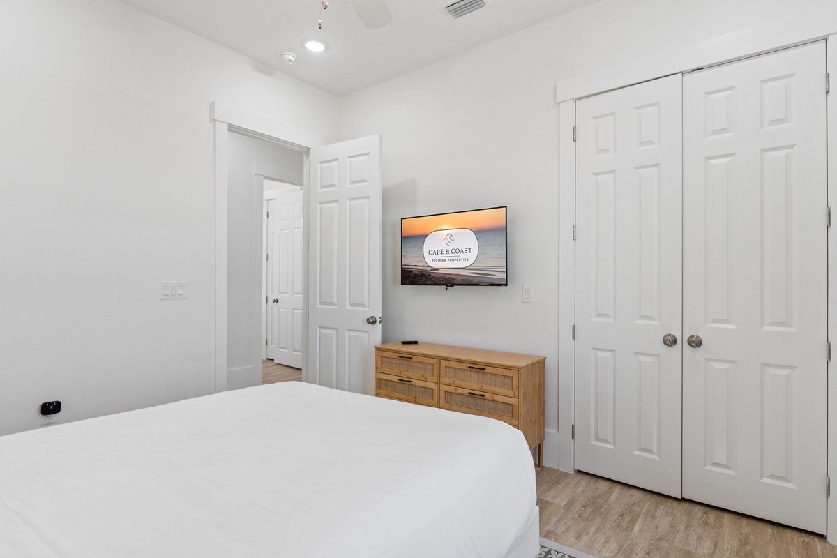 Unwind in your bright bedroom with coastal views on the wall-mounted TV and ample closet space for all your belongings.