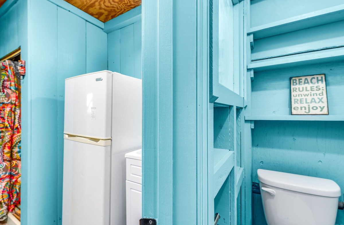 An additional shower, bath, and refrigerator are available in the arcade room